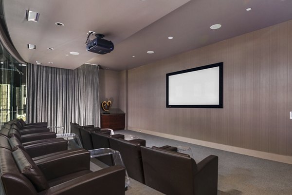 State-of-the-art theater featuring plush seating at 1600 Glenarm Place Apartments, Denver