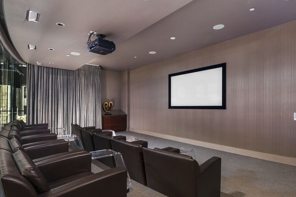 State-of-the-art theater featuring plush seating at 1600 Glenarm Place Apartments, Denver