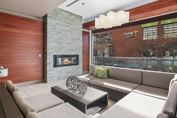 Clubhouse with modern seating and billiards table at 1600 Glenarm Place Apartments
