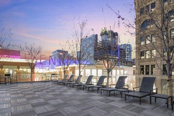 Rooftop deck with breathtaking city views at 1600 Glenarm Place Apartments in downtown Denver, perfect for relaxation and entertainment