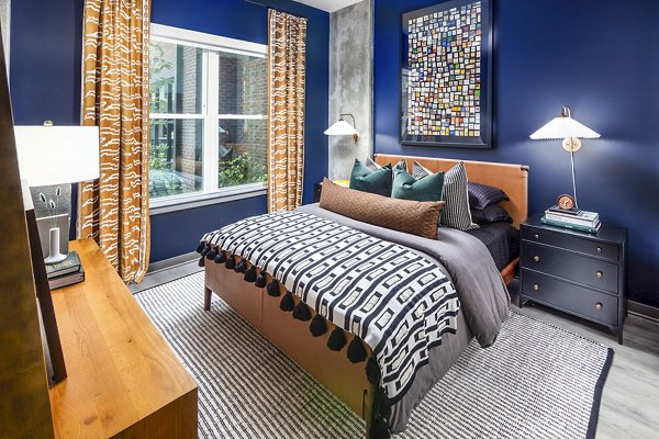 Modern bedroom with elegant decor in Beckon Apartments, a Greystar luxury community, featuring a serene ambiance for ultimate relaxation