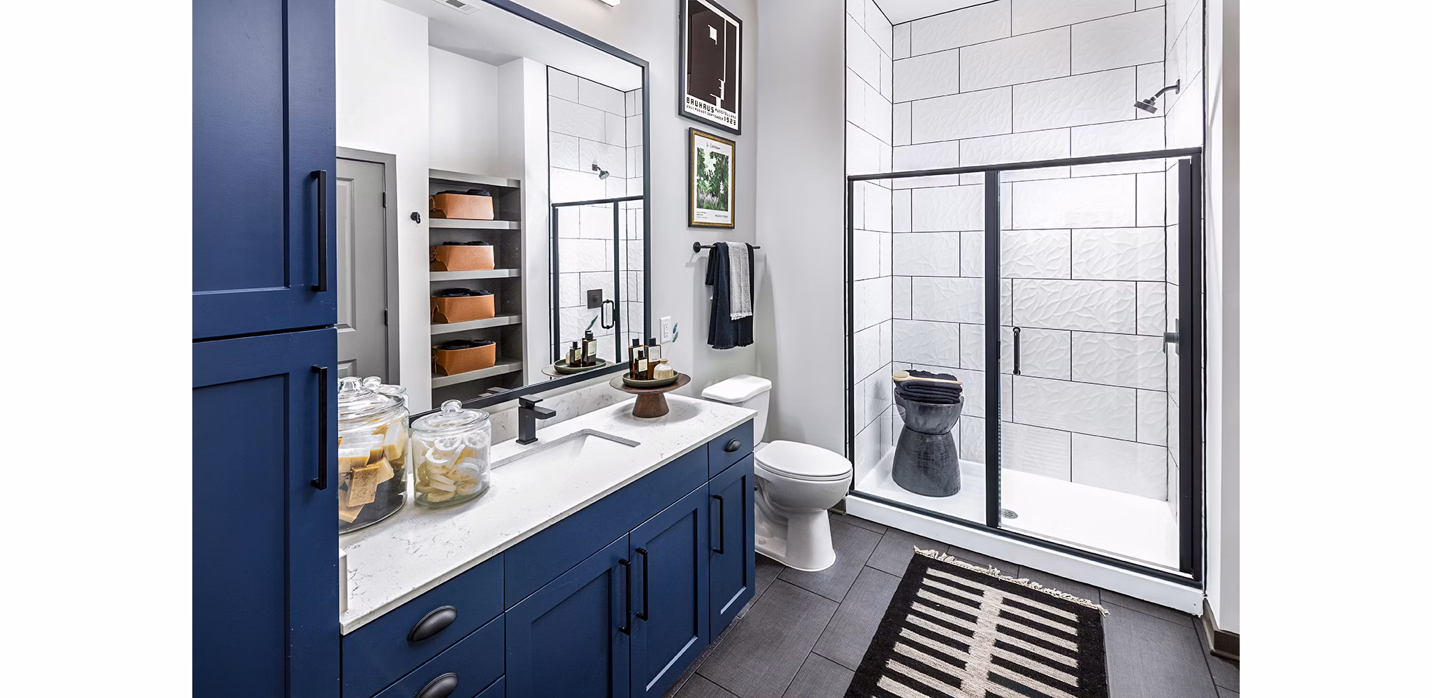 Luxurious bathroom featuring marble countertops and modern fixtures at Beckon Apartments