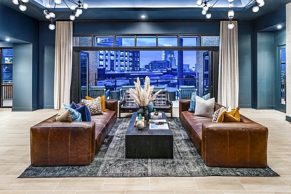 Modern clubhouse featuring cozy seating and entertainment areas at Destinations Pueblo Apartment Homes