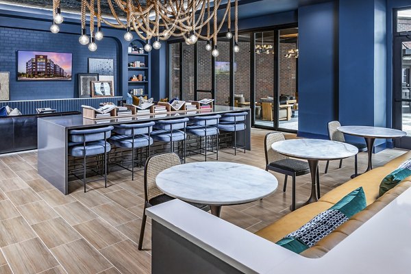 Modern clubhouse with cozy seating at Beckon Apartments
