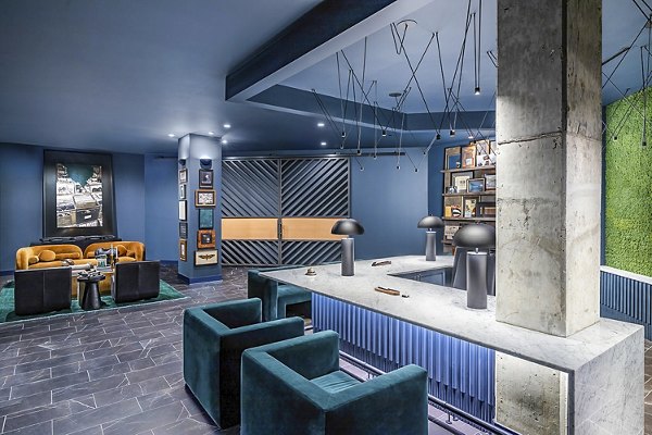 Modern clubhouse with lounge seating at Beckon Apartments