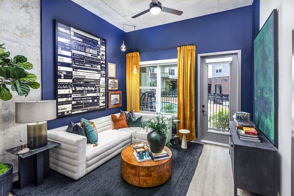 Elegant living room with modern furnishings at Beckon Apartments