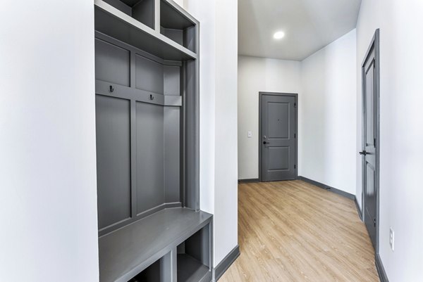 Hallway entrance with stylish decor at Beckon Apartments: Luxury living spaces in a modern setting