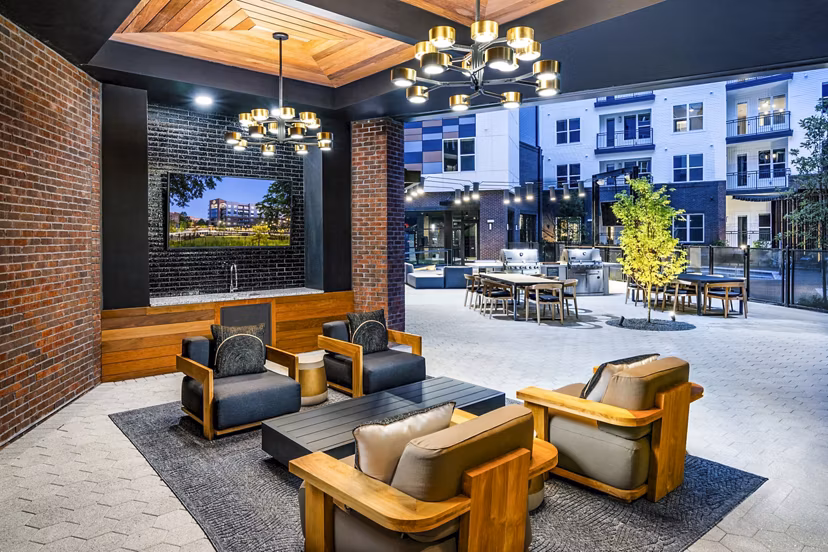 Private patio with modern seating at Beckon Apartments in Greystar luxury setting