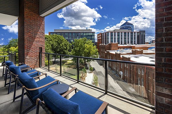 Expansive outdoor patio with seating and city views at Beckon Apartments, luxury living by Greystar