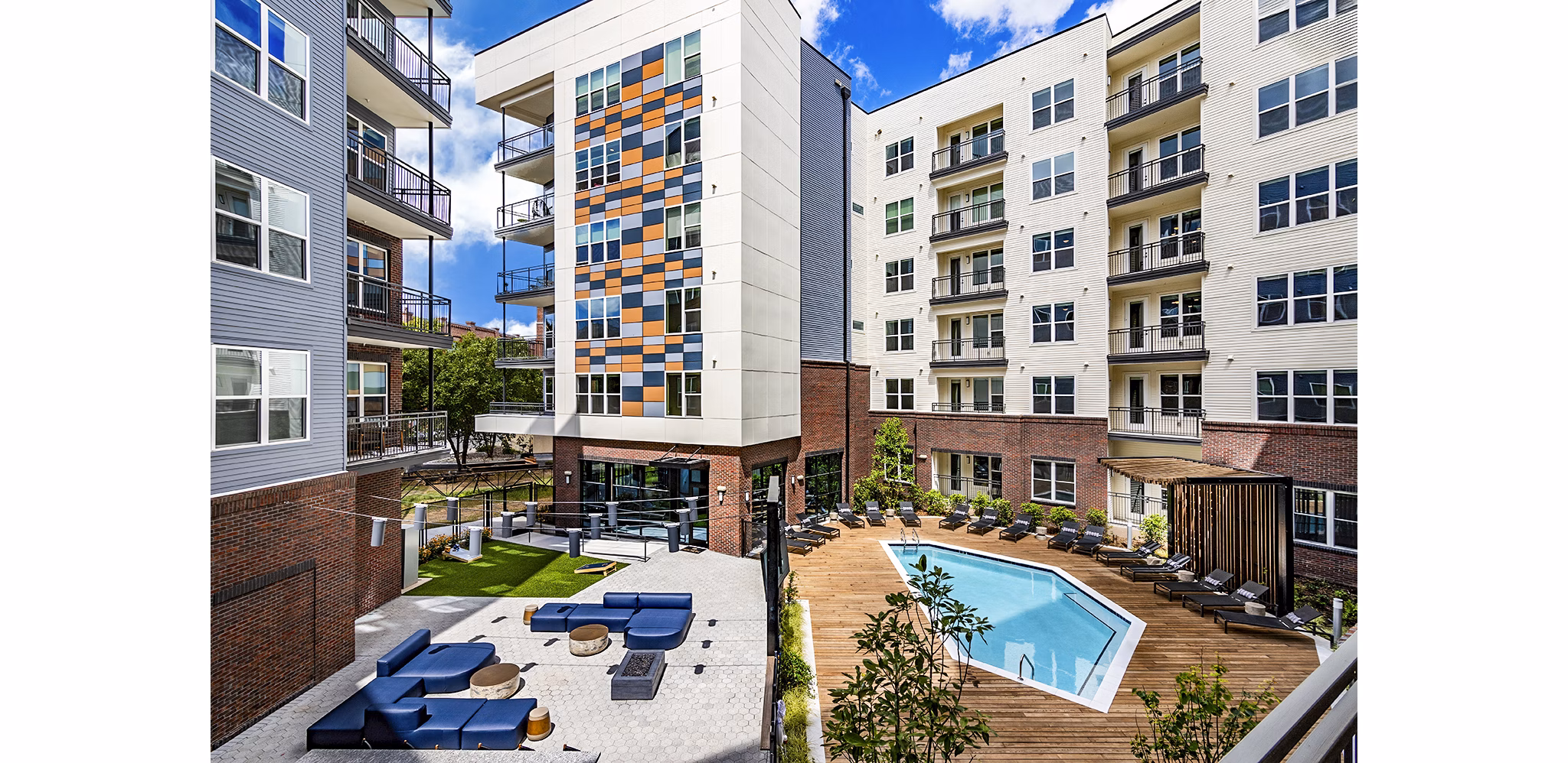 Resort-style swimming pool with lounge chairs at Beckon Apartments, offering luxury living experiences for residents