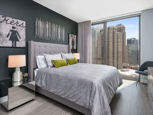 Spacious bedroom with modern decor at 1001 S State Apartments in Chicago