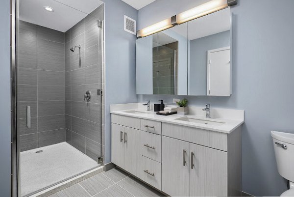 Bathroom featuring sleek fixtures and modern design at 1001 S State Apartments