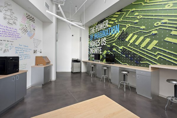 Modern business center with sleek workspaces at 1001 S State Apartments, Chicago