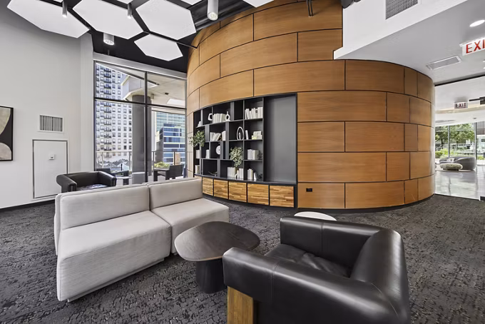 Clubhouse featuring modern decor and spacious seating at 1001 S State Apartments in Chicago