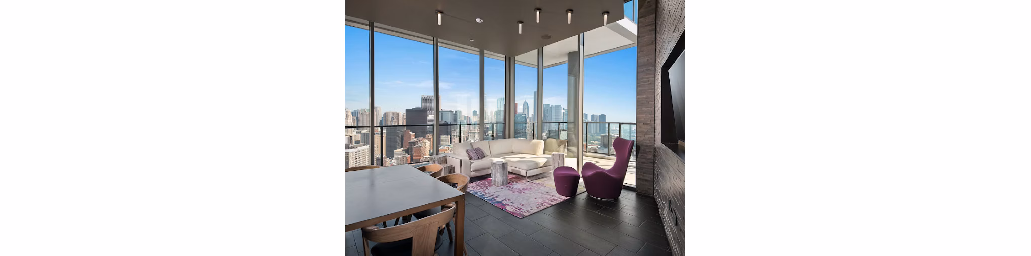 Spacious living room with modern decor and city views in 1001 S State Apartments, luxury living in downtown Chicago