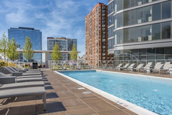 Rooftop pool with city skyline views at 1001 S State Apartments, offering luxury amenities in the heart of the city