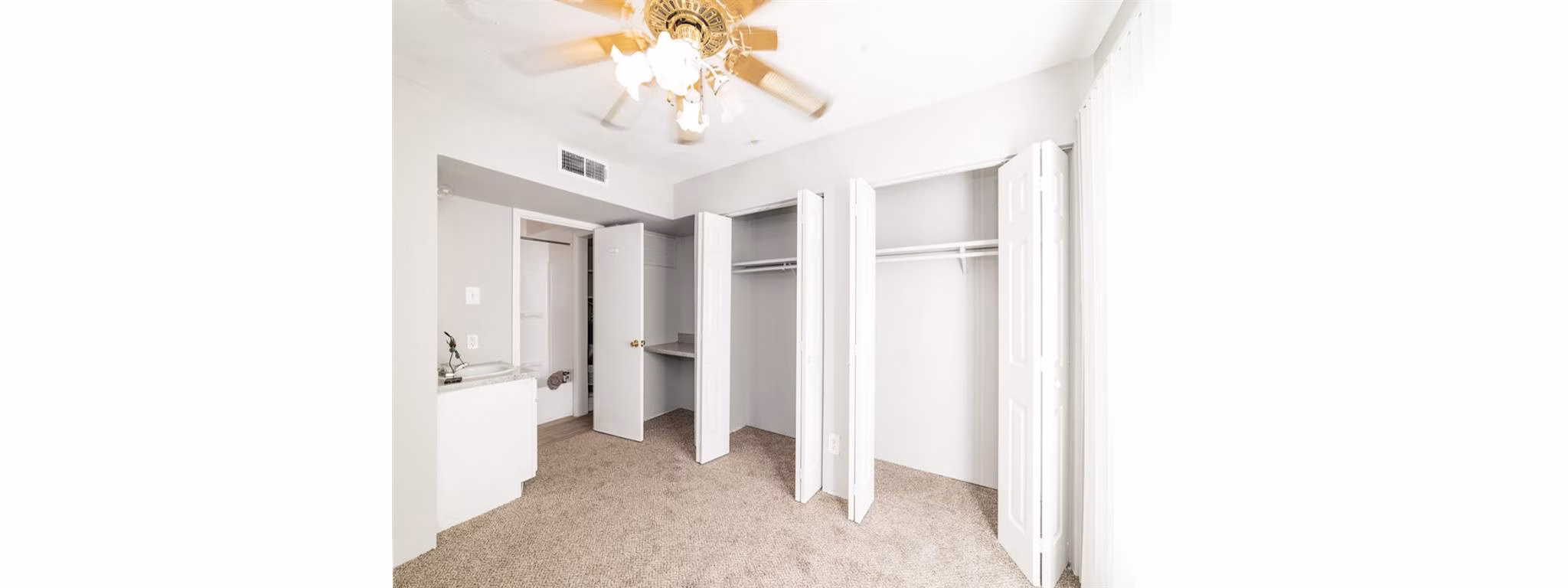 Comfortable bedroom with modern decor at Carelton Courtyard Apartments