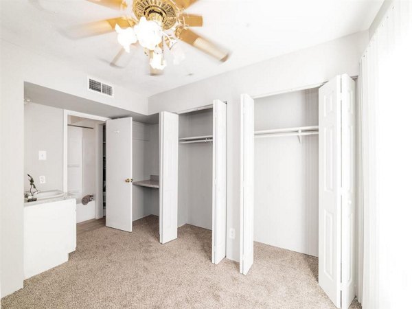 Comfortable bedroom with modern decor at Carelton Courtyard Apartments