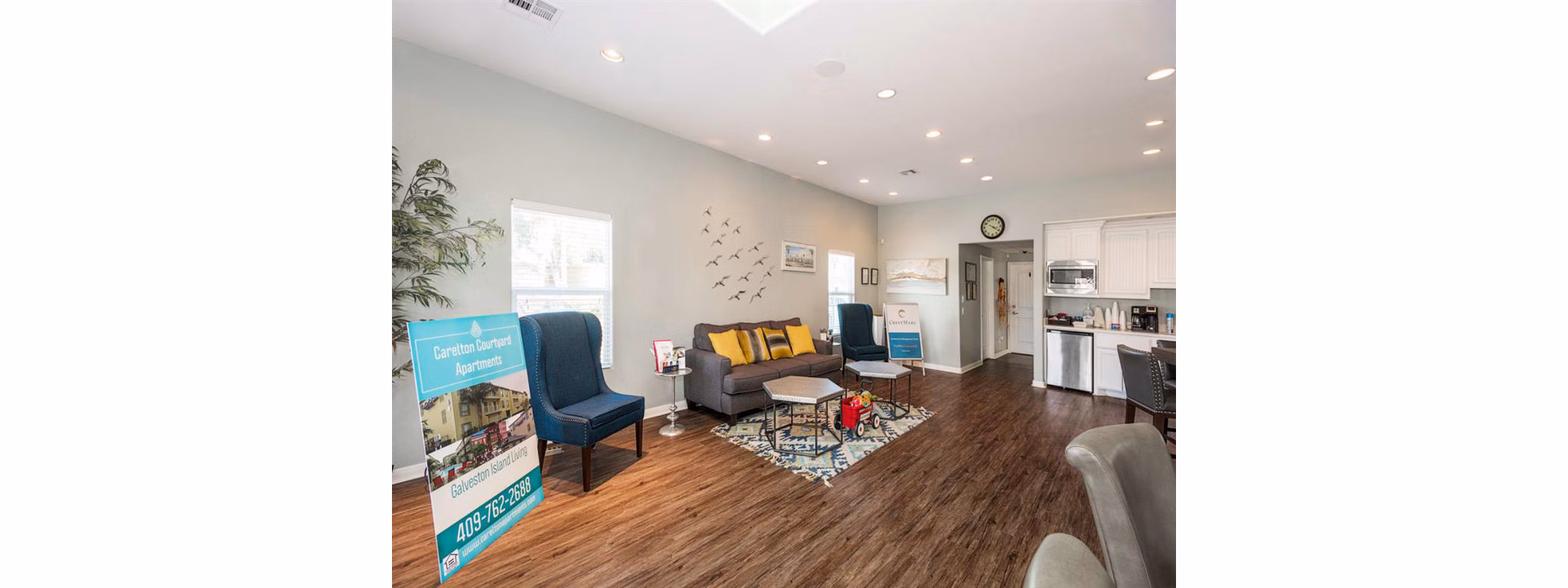 Modern clubhouse featuring a sleek bar and lounge seating at Carleton Courtyard Apartments