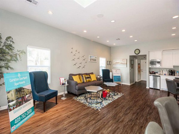 Modern clubhouse featuring a sleek bar and lounge seating at Carleton Courtyard Apartments