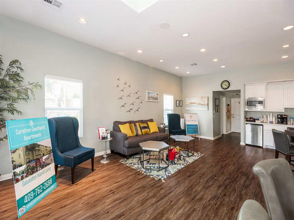 Modern clubhouse featuring a sleek bar and lounge seating at Carleton Courtyard Apartments