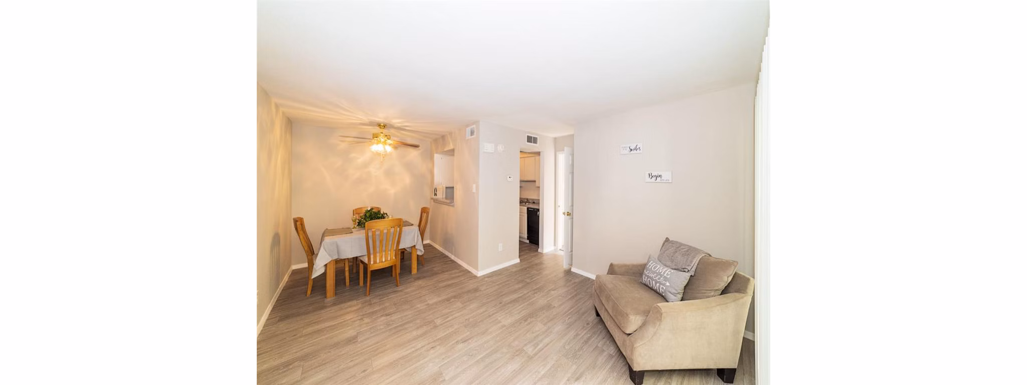 Spacious living room with modern furnishings and natural light in Carelton Courtyard Apartments