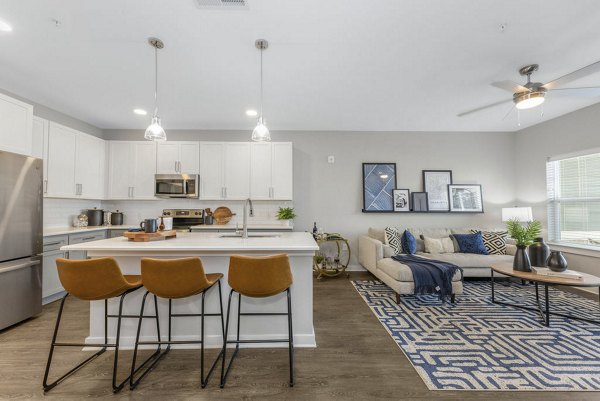Modern kitchen with stainless steel appliances at Indigo at Berewick Apartments