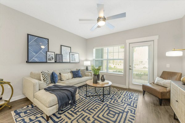 Stylish living room with modern furnishings in Indigo at Berewick Apartments