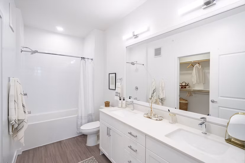 Modern bathroom featuring sleek fixtures and spacious design at Citizen House MLK Apartments