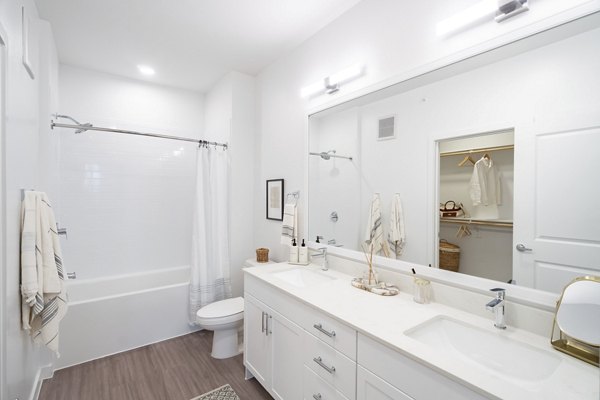 Modern bathroom featuring sleek fixtures and spacious design at Citizen House MLK Apartments