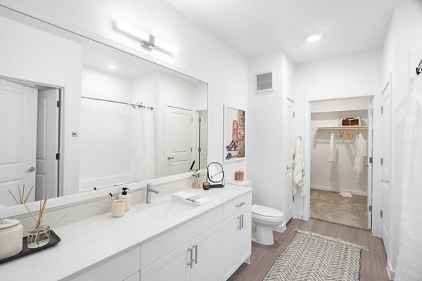Modern bathroom with sleek fixtures in Citizen House MLK Apartments, showcasing luxury apartment living in central location