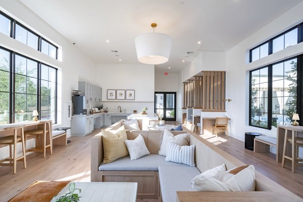 Clubhouse with modern design and seating areas at Citizen House MLK Apartments