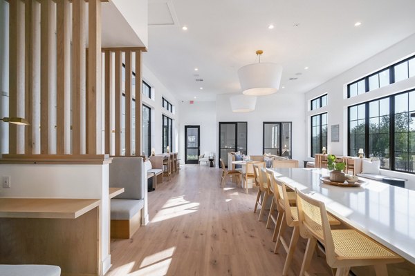 Modern clubhouse with cozy seating and vibrant decor at Citizen House MLK Apartments