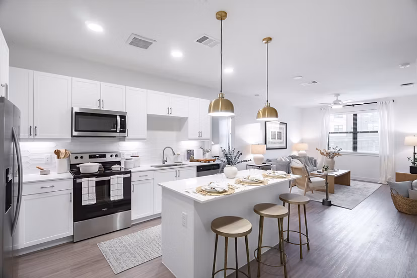 Modern kitchen with stainless steel appliances at Citizen House MLK Apartments in Austin