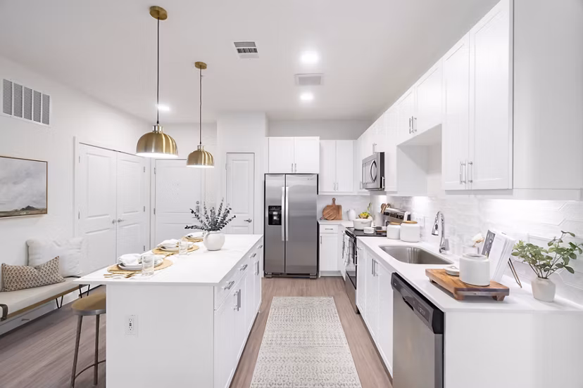 Modern kitchen with stainless steel appliances at Citizen House MLK Apartments, offering luxury living spaces in the heart of the community