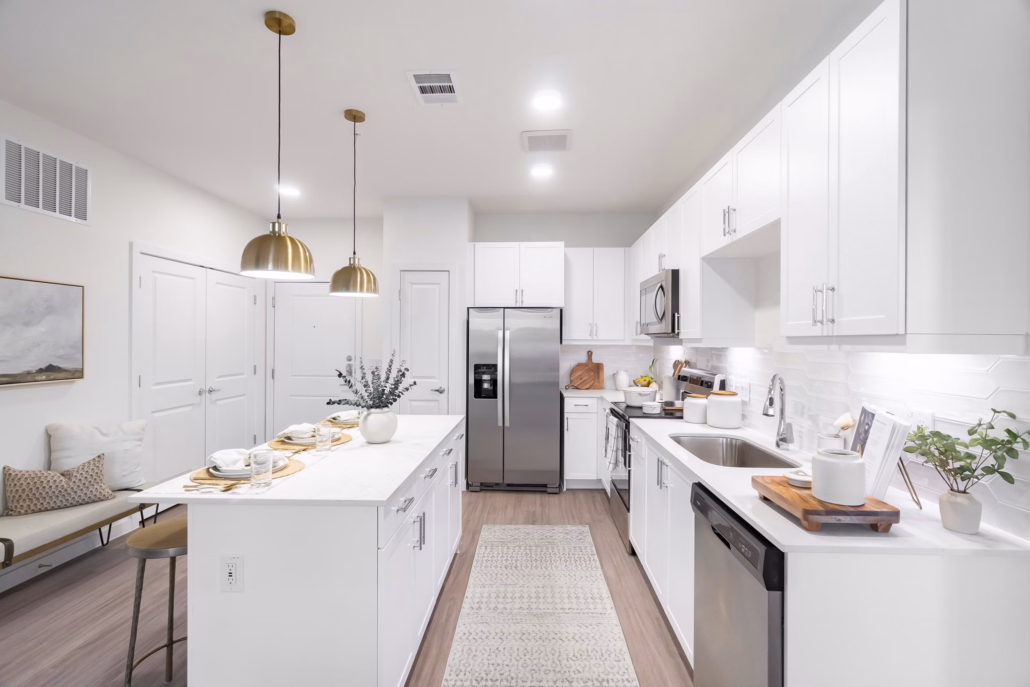 Modern kitchen with stainless steel appliances at Citizen House MLK Apartments, offering luxury living spaces in the heart of the community