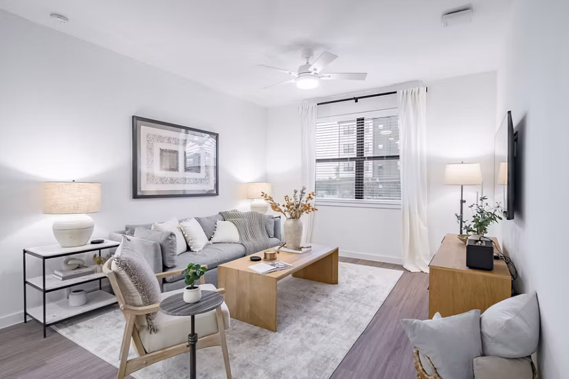 Modern living room with stylish decor at Citizen House MLK Apartments, featuring comfortable seating and open layout