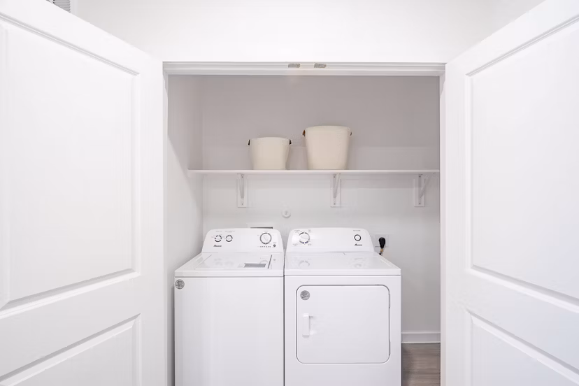 Laundry room with modern appliances at Citizen House MLK Apartments, luxury living by Greystar