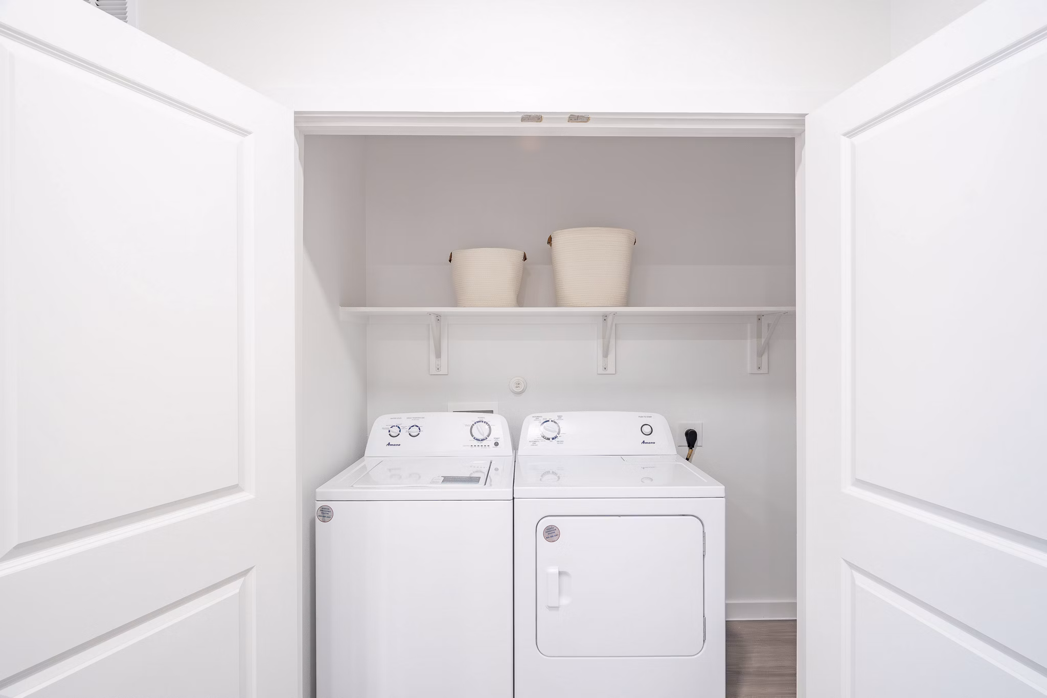 Laundry room with modern appliances at Citizen House MLK Apartments, luxury living by Greystar