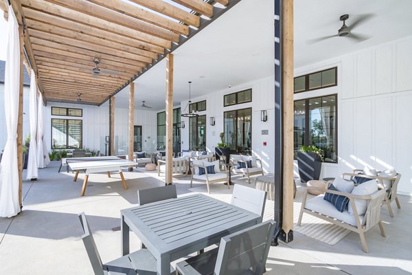 Patio with modern seating and greenery at Citizen House MLK Apartments, offering luxury outdoor spaces in the heart of the city