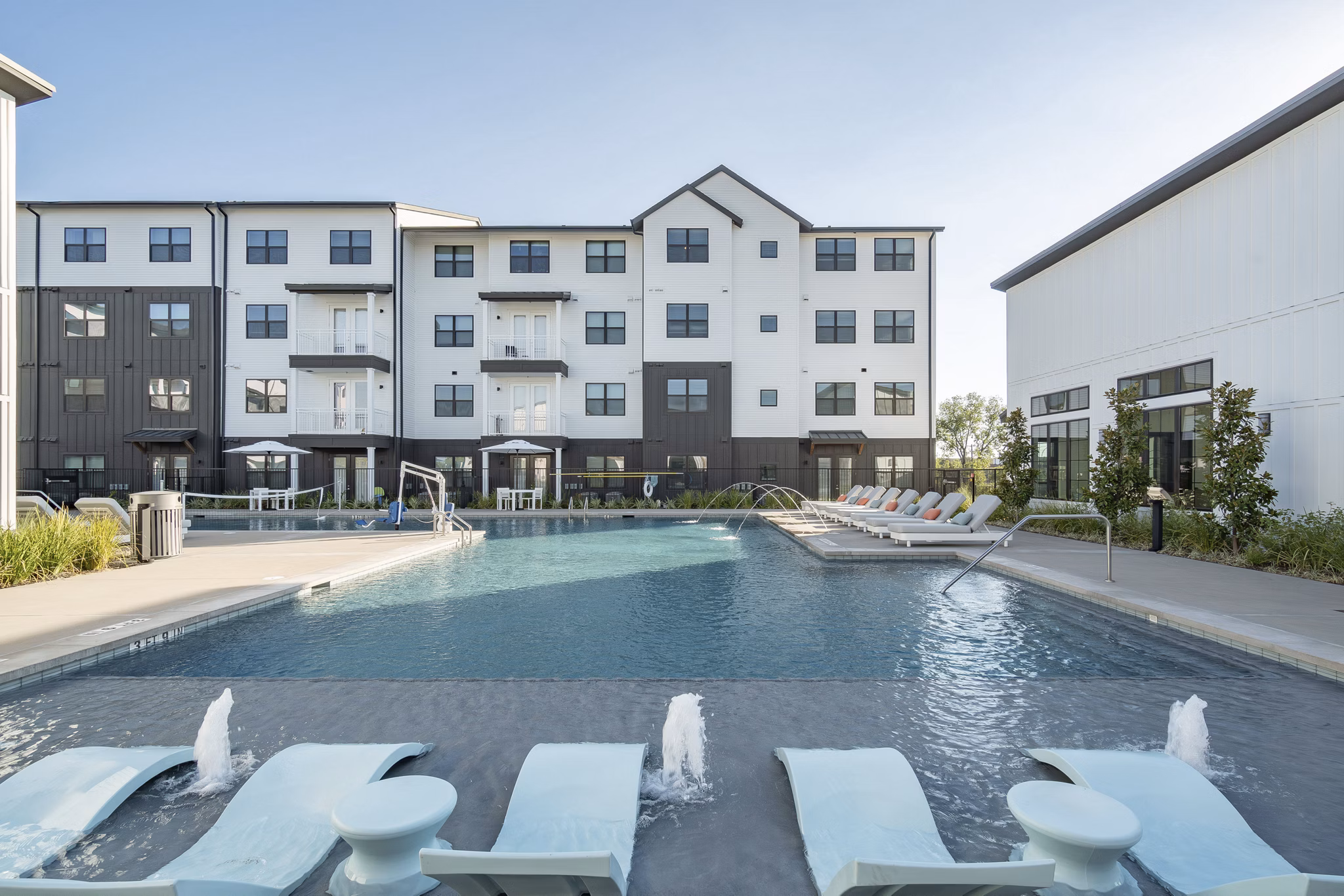 Rooftop pool with city views at Citizen House MLK Apartments, offering luxury living and community events