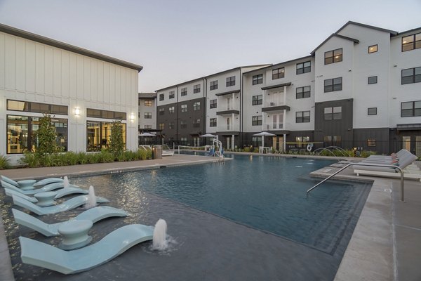 Resort-style pool at Citizen House MLK Apartments offering luxury leisure in a well-appointed outdoor space