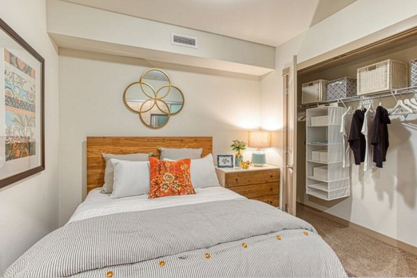 Modern bedroom with stylish decor at Ethos Apartments featuring luxury living in a vibrant community