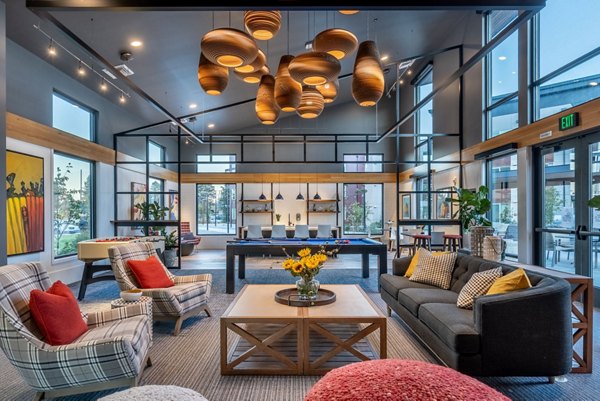 Modern clubhouse featuring open lounge and game room at Ethos Apartments