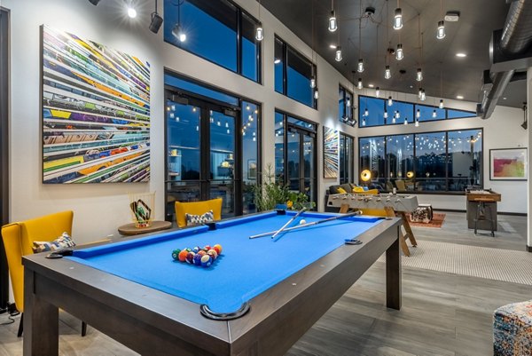 Modern clubhouse with social lounge and entertainment area at Ethos Apartments, perfect for gatherings and relaxation