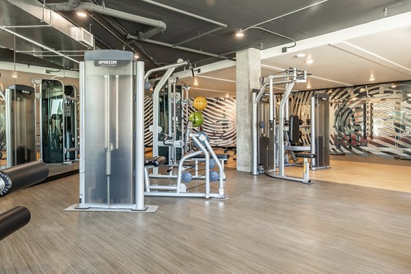 State-of-the-art fitness center with modern equipment at Ethos Apartments, perfect for active lifestyles in a luxury setting