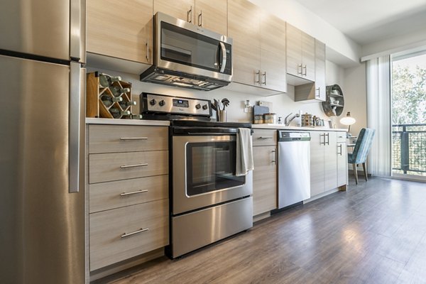Spacious kitchen with modern appliances at Ethos Apartments
