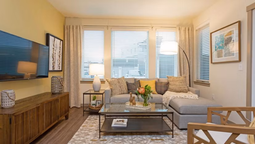 Spacious living room with modern decor at Ethos Apartments
