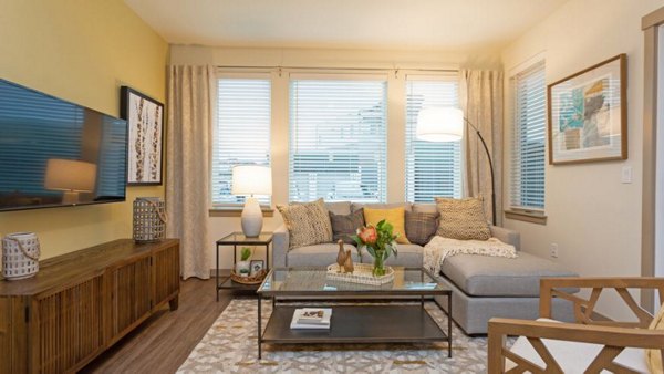 Spacious living room with modern decor at Ethos Apartments