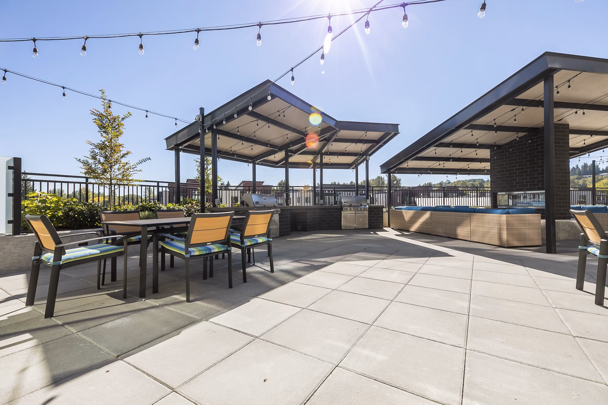 Ethos Apartments: Tranquil courtyard with modern seating in vibrant community setting